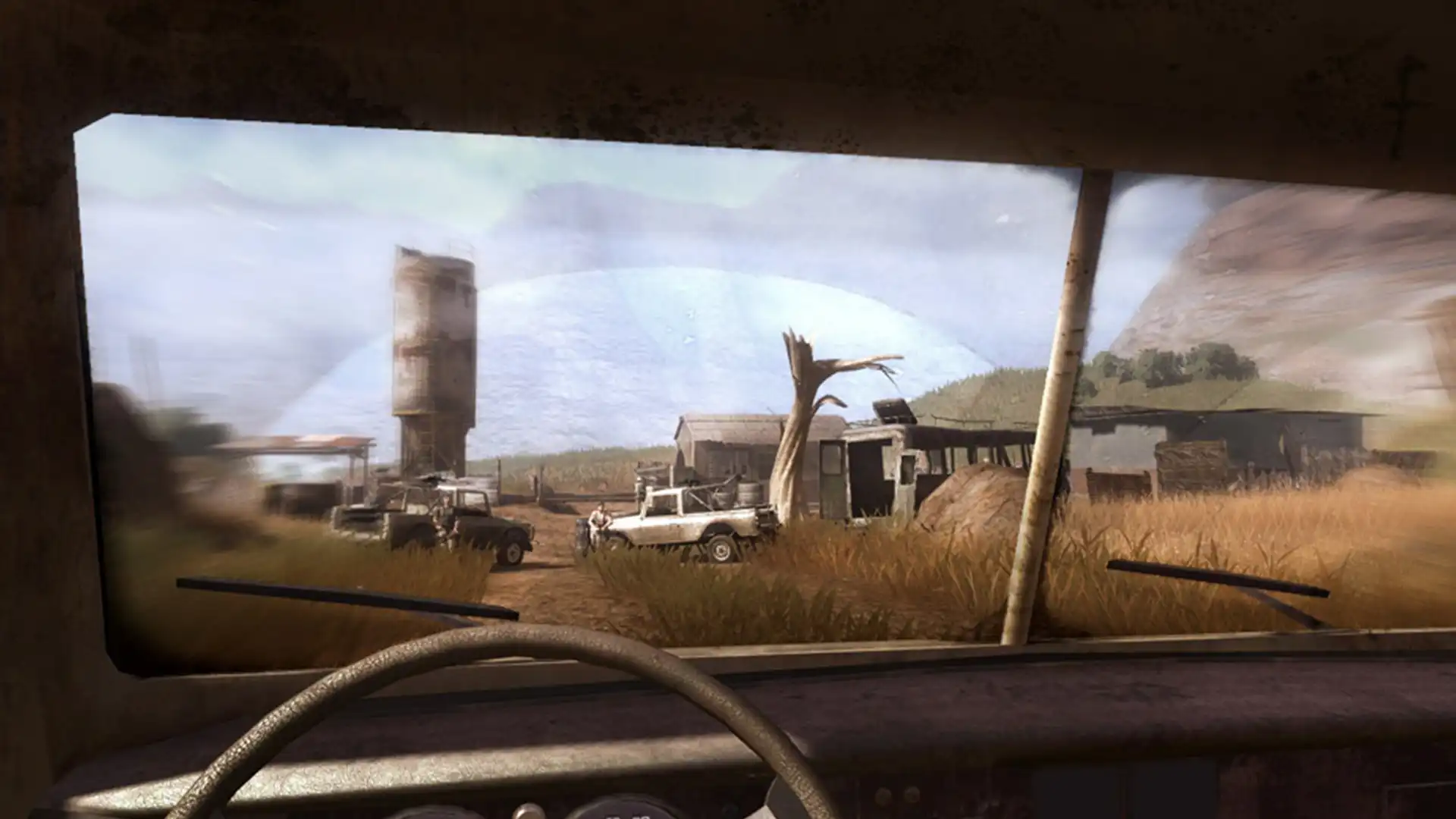 Вид из кабины автомобиля в Far Cry 2 на африканский ландшафт.