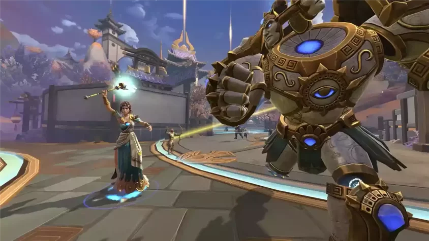 Герои SMITE готовятся к сражению на фоне древних зданий.