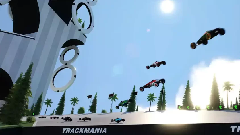 Автомобили Trackmania выполняют прыжки на трассе с петлями