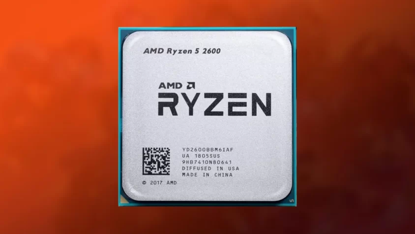 Процессор AMD Ryzen 5 2600 на фоне оранжевого оттенка.
