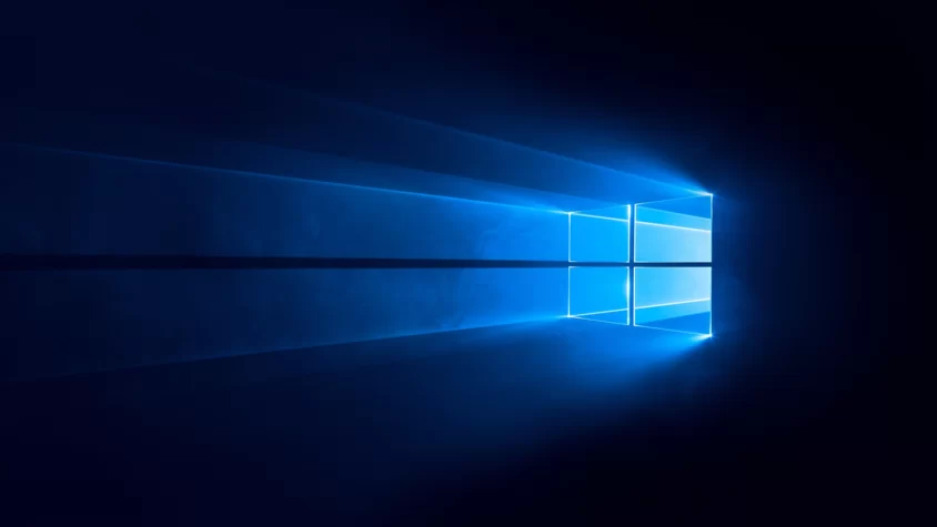 Логотип Windows, светящийся на тёмно-синем фоне
