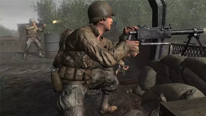 Скриншот игры Call of Duty 2: танк и солдаты на фоне разрушений