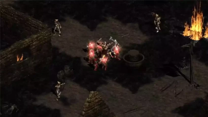 Скриншот Diablo II с героями, сражающимися с врагами в темных подземельях