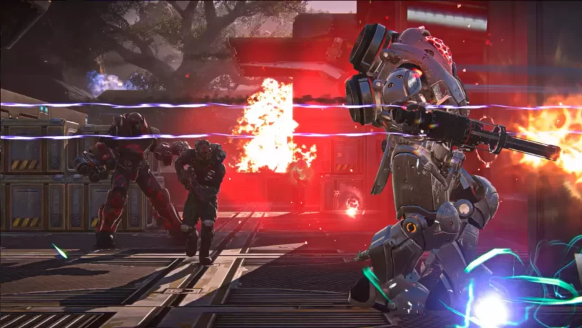 Скриншот из игры PlanetSide 2 с двумя роботами в борьбе на фоне огня и взрывов