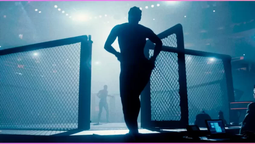 Скриншот бойца, выходящего в арену через клетку UFC с заднего плана