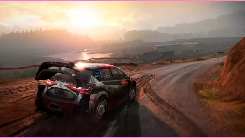 Скриншот из игры WRC 7, автомобиль на гравийной дороге под дождем