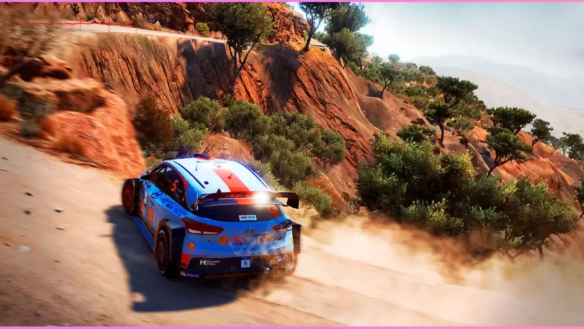 Скриншот из игры WRC 7, автомобиль на извилистой дороге в солнечное время суток