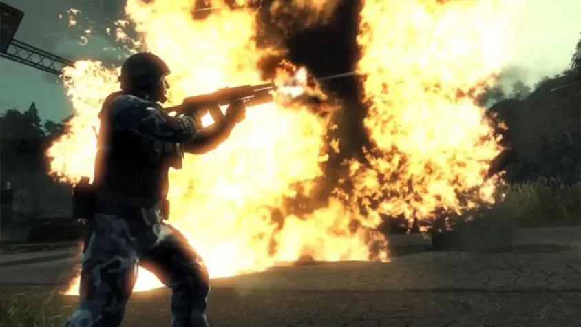 Солдат стреляет из оружия на фоне огня в Battlefield: Bad Company