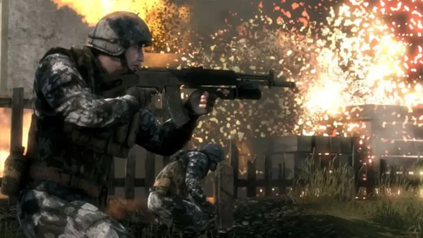 Солдат с автоматом и взрывами на заднем плане в Battlefield: Bad Company