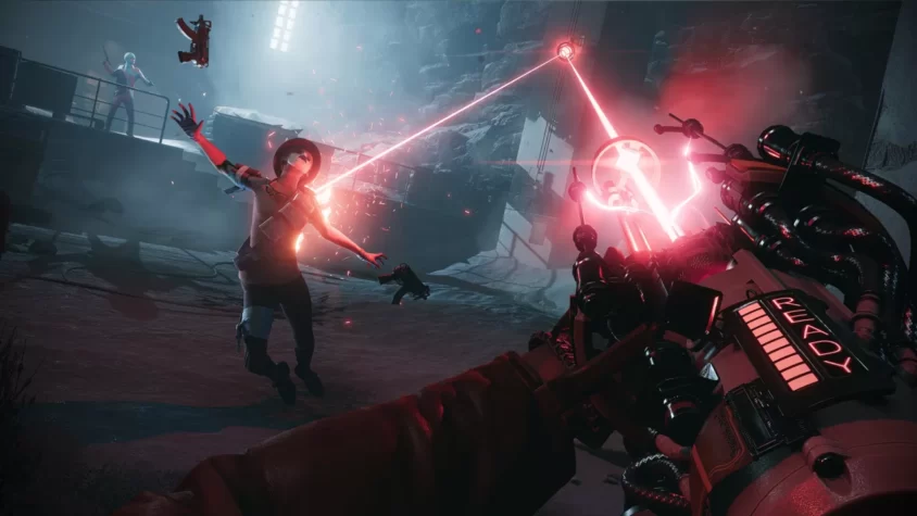 Герой игры DEATHLOOP нацелился на противника с помощью оружия, из которого вырываются красные лазеры