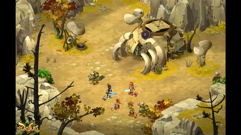 Персонажи в пустынной местности, готовятся к битве в игре Dofus