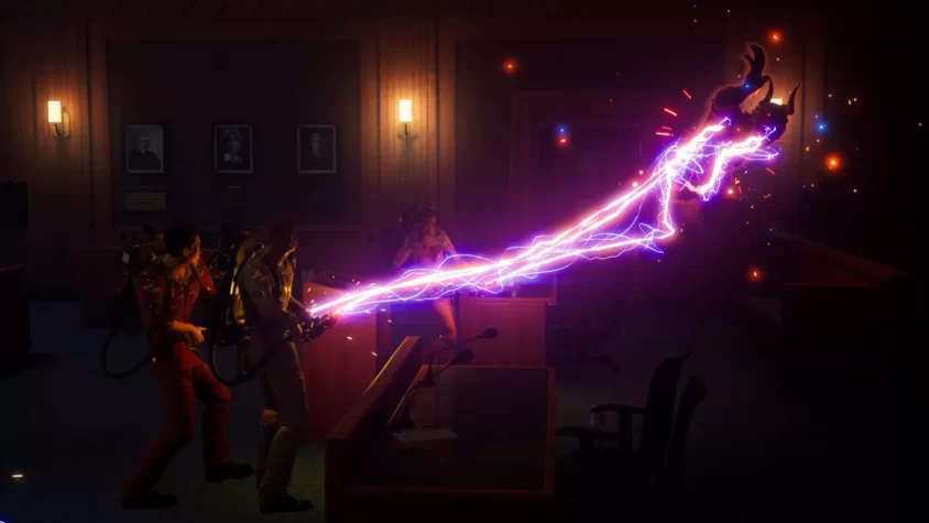 Герои с оружием, стреляющие в привидение в игре Ghostbusters: Spirits Unleashed