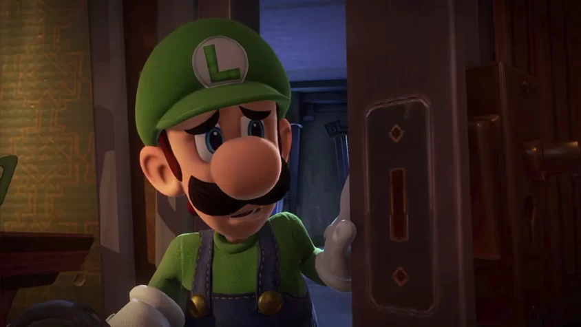 Луиджи с обеспокоенным выражением лица у двери в Luigi's Mansion 3