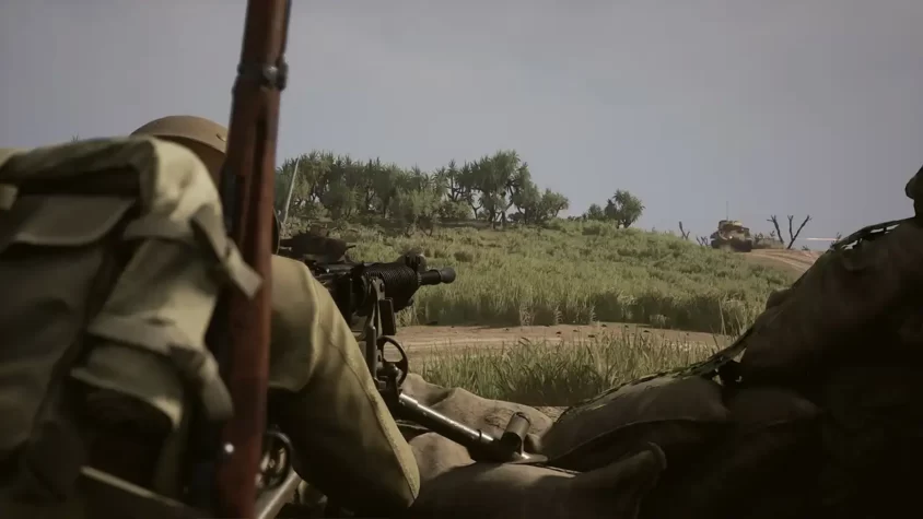 Скриншот игры Squad 44, изображающий солдата с пулемётом на фоне танка