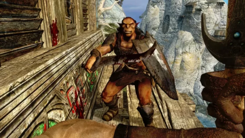 Герой Dark Messiah of Might and Magic сражается с чудовищем на фоне высоких гор