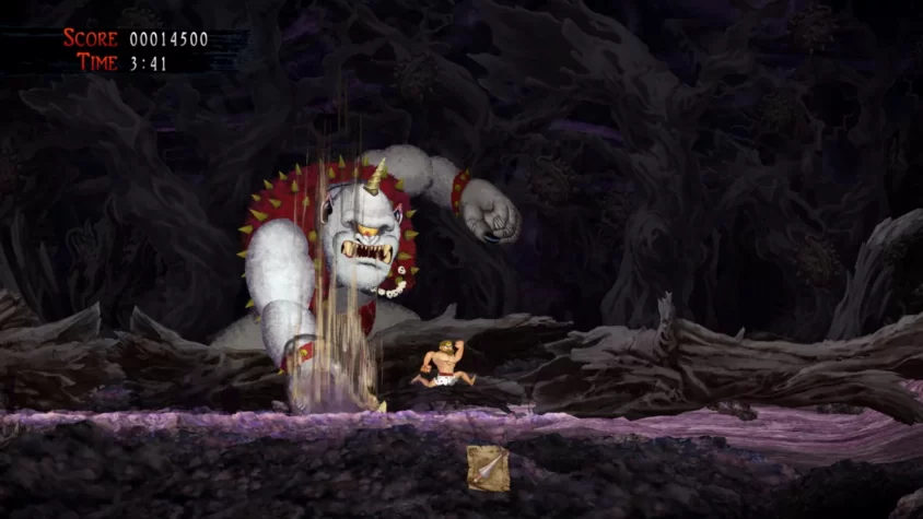 Герой игры Ghosts 'n Goblins Resurrection сражается с гигантским монстром в темной пещере