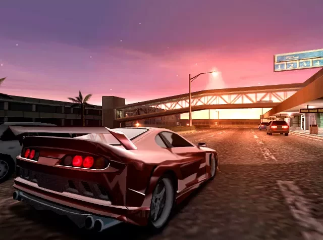 Гоночный автомобиль на фоне заката, в игре Midnight Club II