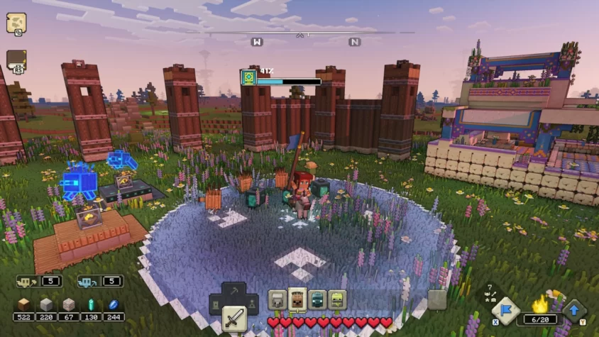 Главный герой Minecraft Legends с флагом стоит рядом с частично построенным сооружением и противниками в окружении цветов