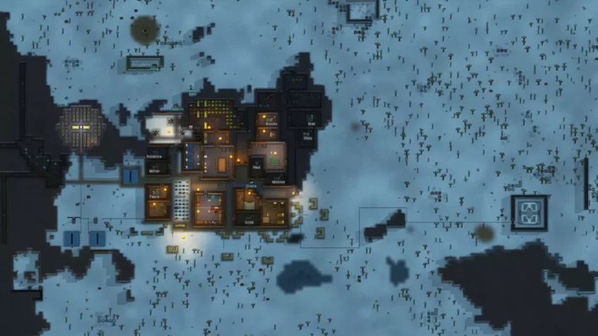 Колония в снежной пустыне RimWorld, с множеством построек и энергетических установок