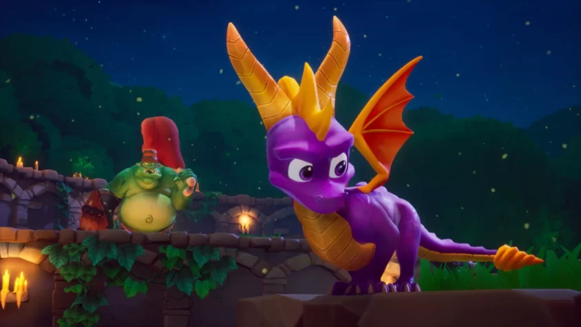 Spyro и его враг в ночной битве с фоном в виде заброшенной крепости