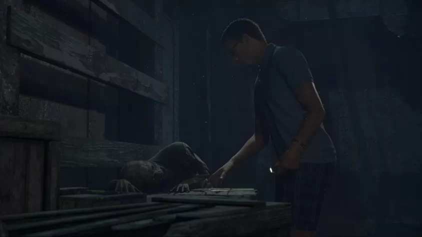 Персонаж в The Dark Pictures Anthology: Man of Medan решает, стоит ли трогать этого мертвеца или лучше отойти подальше