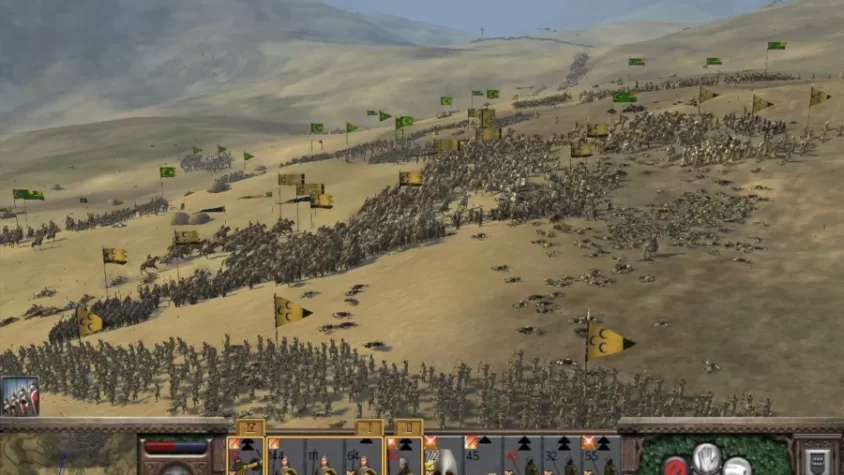 Массированное наступление армий на холмах в игре Total War: Medieval II