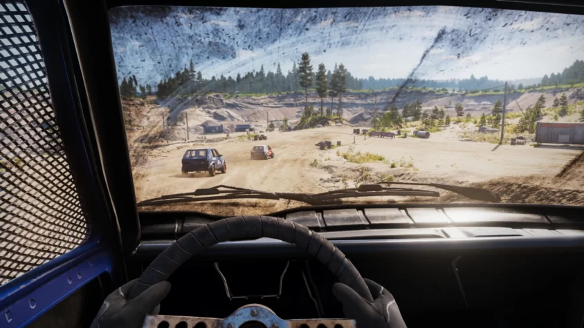 Вид из кабины автомобиля в игре Wreckfest 2 на гоночной трассе с грязью