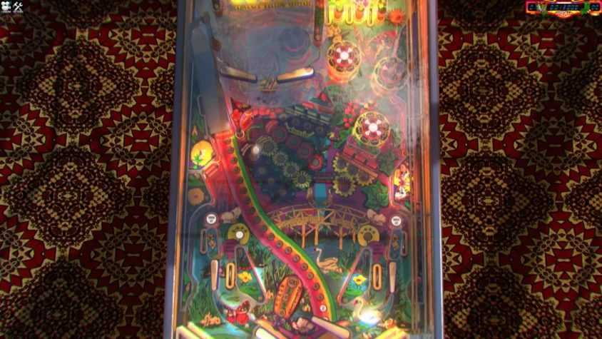 Игровое поле Zaccaria Pinball с яркими и разнообразными элементами, включая воду и природу