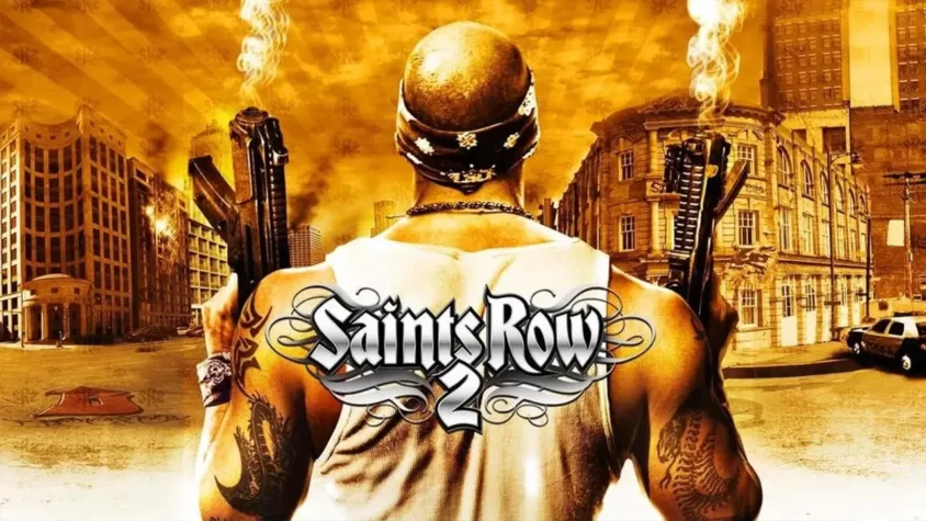 Обложка игры Saints Row 2 Главный герой с татуировками и пушками на фоне горящего города